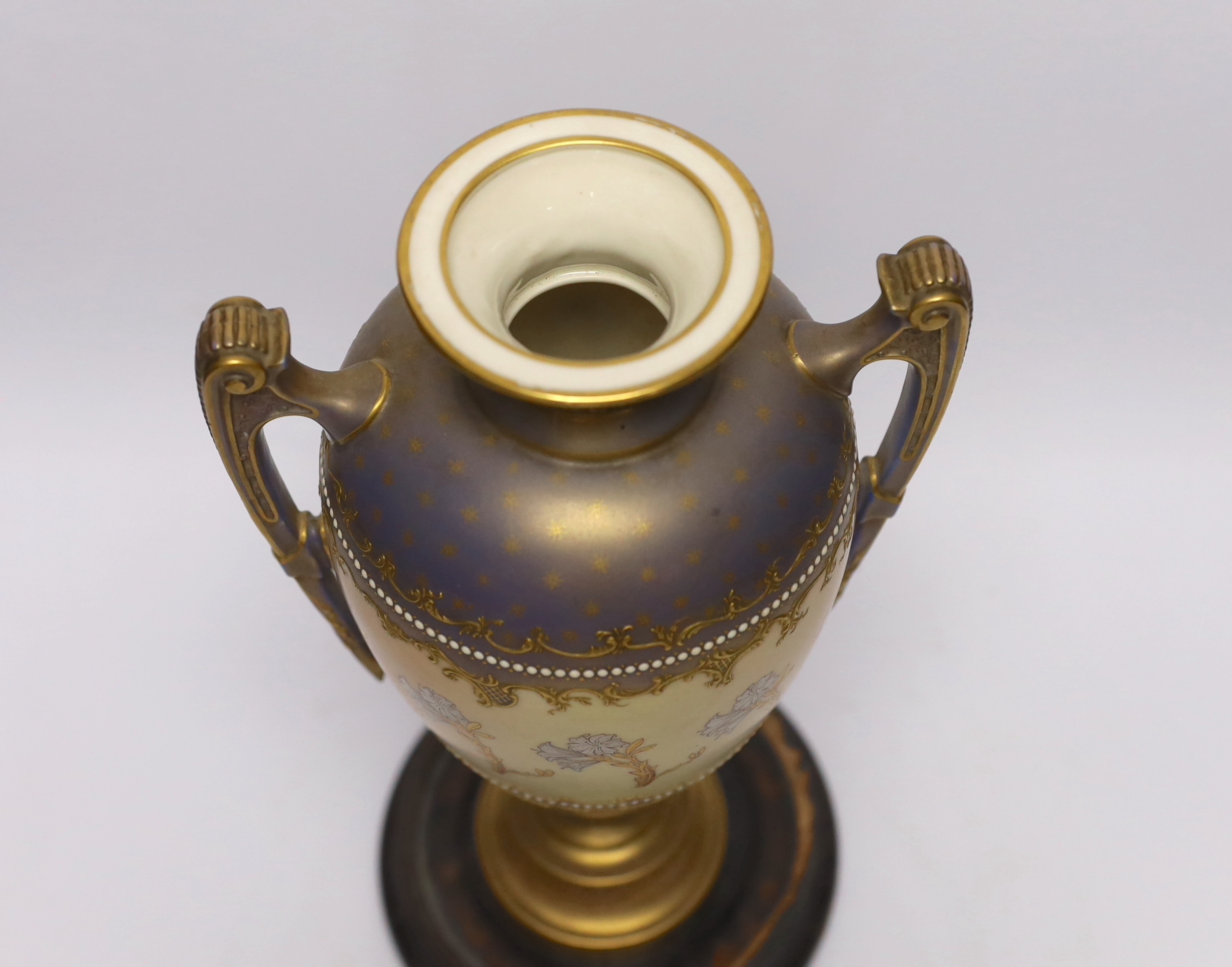 A Royal Worcester blush ivory two handled vase, model no. 1481, with hardwood stand, 31cm